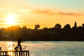 Fishing silhouette at sunset