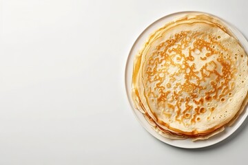 Stack of thin pancakes on a white plate