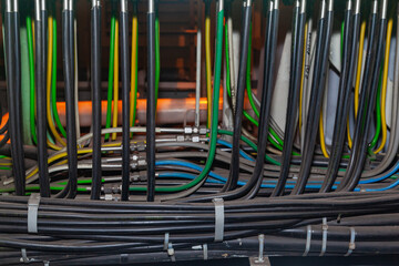 Hydraulic tube line and electrical cables.