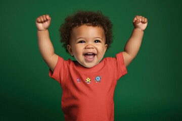 Canvas Print - Cheering toddler in red t-shirt