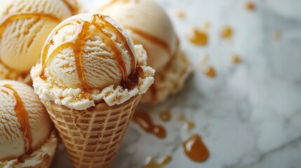 Poster - Scoops of ice cream golden caramel sauce and a crispy cone set on a sleek white marble surface perfect for summer indulgence The setup offers a stylish closeup with space for text