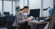 © Framestock - Workplace of managers of large financial company: Adult, beautiful female analyst checking data in paper documents for changes in foreign exchange rates. Monitoring stock and equity markets concept.