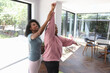© Caia Image - Woman supports her disabled friend while practicing yoga