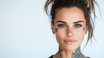 A relaxed portrait of a young woman with tattoos and piercings, smiling with a natural expression, capturing her unique style and carefree attitude.