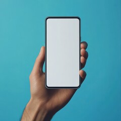 Wall Mural - male hand holding bezel-less smartphone with blank screen, isolated on blue background . Screen is cut out with path