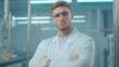 © JP STUDIO LAB - Aspiring researcher standing proud in a state-of-the-art lab, arms crossed, highlighting the dedication and enthusiasm in the scientific field