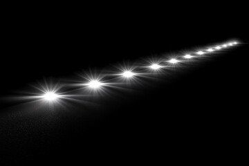 Bright white lights with lens flare effects, aligned on a horizontal line in a dark black background, for overlay or screen filter, with a minimalist and futuristic vibe
