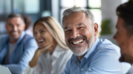 A cheerful businessman engages with his colleagues during a vibrant meeting in a modern office setting