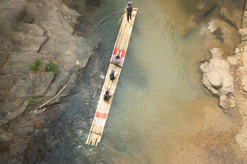 Bamboo rafting in green tropical scenery as a tour for tourist in Mae Wang District Chiang Mai Thailand