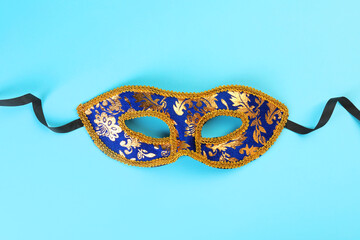 Sticker - One beautiful carnival mask on light blue background, top view