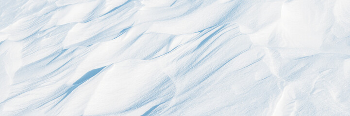 Wall Mural - snow texture. wind sculpted patterns on snow surface. wind in the tundra and in the mountains on the