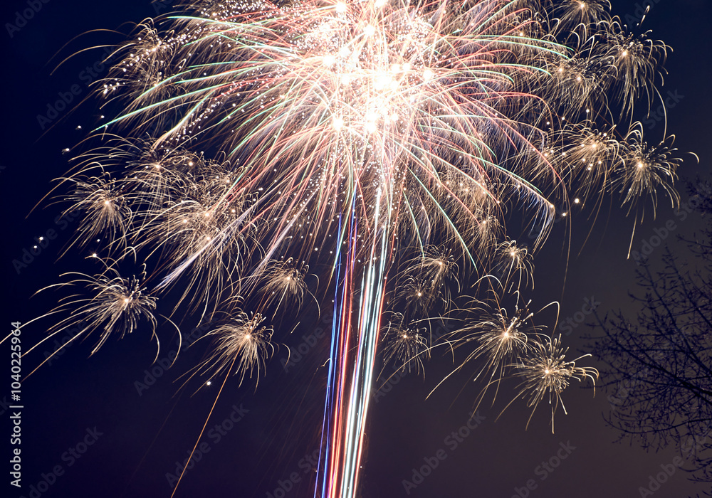 Bright fireworks explode in the night sky, creating a colorful and ...