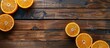 © Ilgun - Wooden table with sliced oranges and blank space for decorating and displaying items in a copy space image