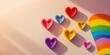 © Anzhela - Artistic minimalistic stock photo featuring colorful hearts and rainbow elements in joyful setting