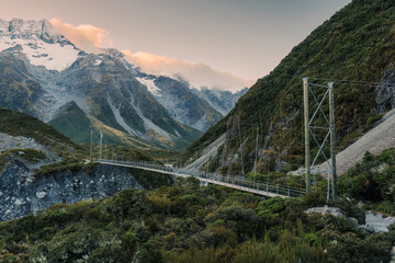 Wall Mural - View of suspension bridge with mountain range on Hooker Valley Track in national park at New Zealand