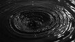 © CYBERPINK - A drop of water is falling into a large circular puddle