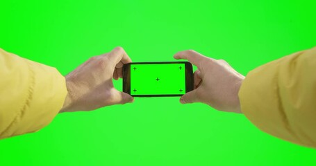 A Person Holding A Cell Phone In Their Hands On A Green Screen Rolling Green Hills Animation Augmented Reality