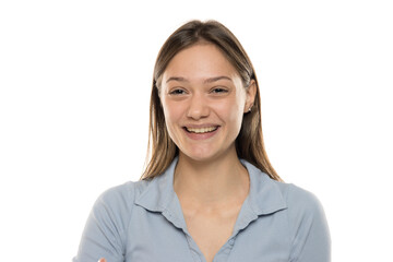 Wall Mural - Portrait of a beautiful young happy woman without makeup on a white studio background