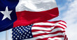© rarrarorro - Texas state flags waving in the wind with american flag
