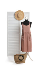 Poster - Female mannequin with stylish dress, straw hat and bag against white background