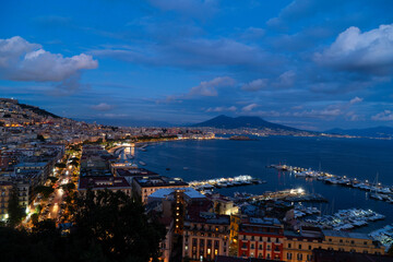 Wall Mural - panoramic cityscape Naples with Vesuvius volcano at night, Italy