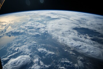 Aufkleber - A stunning image features Earth enveloped by swirling clouds, offering a striking display of atmospheric dynamics, natural shapes, and the planet's grand scale.