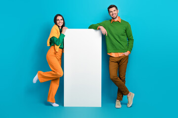 Poster - Full length photo of two people advertise smart board internet shopping smart gadgets isolated blue color background
