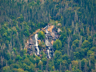 Poster - Waterfalls flowing on the steep cliffs of the Saguenay fjord, Quebec, Canada