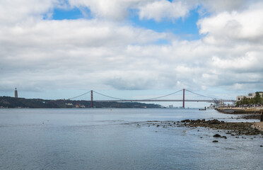 A view of the Tagus River near Lisbon with the famous 25th of April Bridge in the distance.