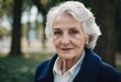 © Julija - Sophisticated older French woman is in the open air. Demeanor reveals a lifetime of experiences and reflections, embodying grace and wisdom. Well-groomed woman 70 years old with grey hair. AI
