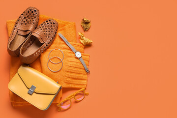 Canvas Print - Stylish bag and different accessories on orange background