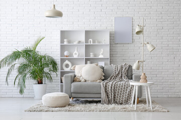 Sticker - Sofa, shelving unit, houseplant and coffee table in interior of living room