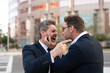 © be free - Conflict between boss and employee. Fight aggression. Angry businessmen. Business conflict. Two businessmen conflicting at fight outdoor. Businessmen having conflict in business. Fight in city