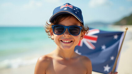 A portrait of an Aussie boy wearing sunglasses reflecting the Australian flag's colours and a cap with an Australian flag waving in the background. Australia Day celebration.