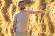 © Volodymyr - Hispanic man farmer keeping hay. Farmer In Wheat Field After Harvest Examining Hay. Crops After Harvesting. Farm Lifestyle. Barn, Hay Rolled Bales. Hay On Farm. Livestock Farming.