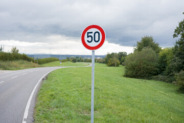 Speed limit sign 50 km per hour. Traffic rules. Driving school. Compliance with speed.