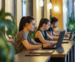 © 1 MEDIA - Young professionals working in a modern coworking space with laptops
