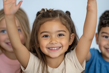 Poster - A young girl is smiling and holding her hands up in the air