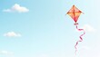 © Leksa - Colorful kite flying in a clear blue sky with fluffy white clouds, perfect for springtime activities