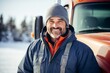 © Baba Images - Portrait of a middle aged male truck driver in front of truck during winter