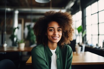 Wall Mural - Portrait of a smiling young African American hipster woman in office