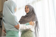 © Art_Photo - Young muslim woman hugging her friend expressing care emotional support friends, women in hijab embrace, showing compassion and love, friendship bond, close friends sharing affection and kindness