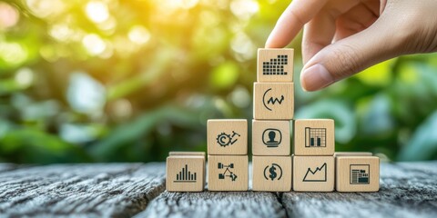 Aufkleber - Business strategy and goal planning concept, represented by a hand stacking wooden blocks with strategic icons, illustrating business development.
