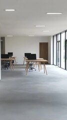 Poster - Modern Minimalistic Office Space with Clean Design and Natural Light, Featuring Empty Desks and Monitors
