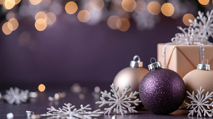 Elegant Christmas ornaments, sparkling snowflakes, and a gift box on a dark background with festive bokeh lights