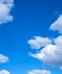 Wall Mural - a peaceful scene of a blue sky dotted with soft, white cumulus clouds, perfect for backgrounds and d