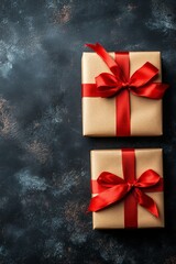 Two elegantly wrapped gifts with red ribbons rest on a dark background, highlighting the excitement of holiday shopping during Black Friday