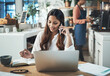 © peopleimages.com - Creative woman, laptop and phone call in coffee shop meeting for startup, artist or small business agency. Designer, notes and art director happy for project proposal, planning or entrepreneur goals