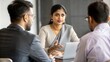 © N7 - Indian Woman Giving Feedback in Meeting