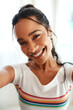© peopleimages.com - Woman, portrait and smile selfie for profile picture, vlog or social media post at home. Happy, influencer or creative vlogger in POV with casual fashion, photo or memory in house living room